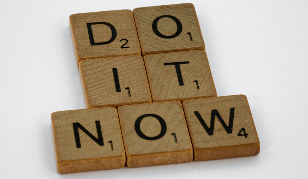 "Do It Now" spelled out in Scrabble tiles to represent using CTAs in your website.