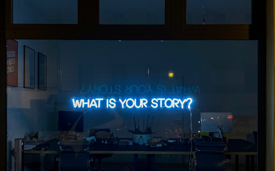 A neon sign in a window that reads: what's your story, to indicate storytelling on your website.