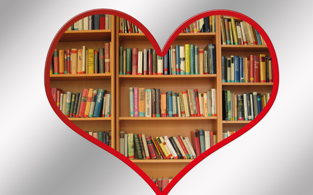 a bookshelf framed in a heart.