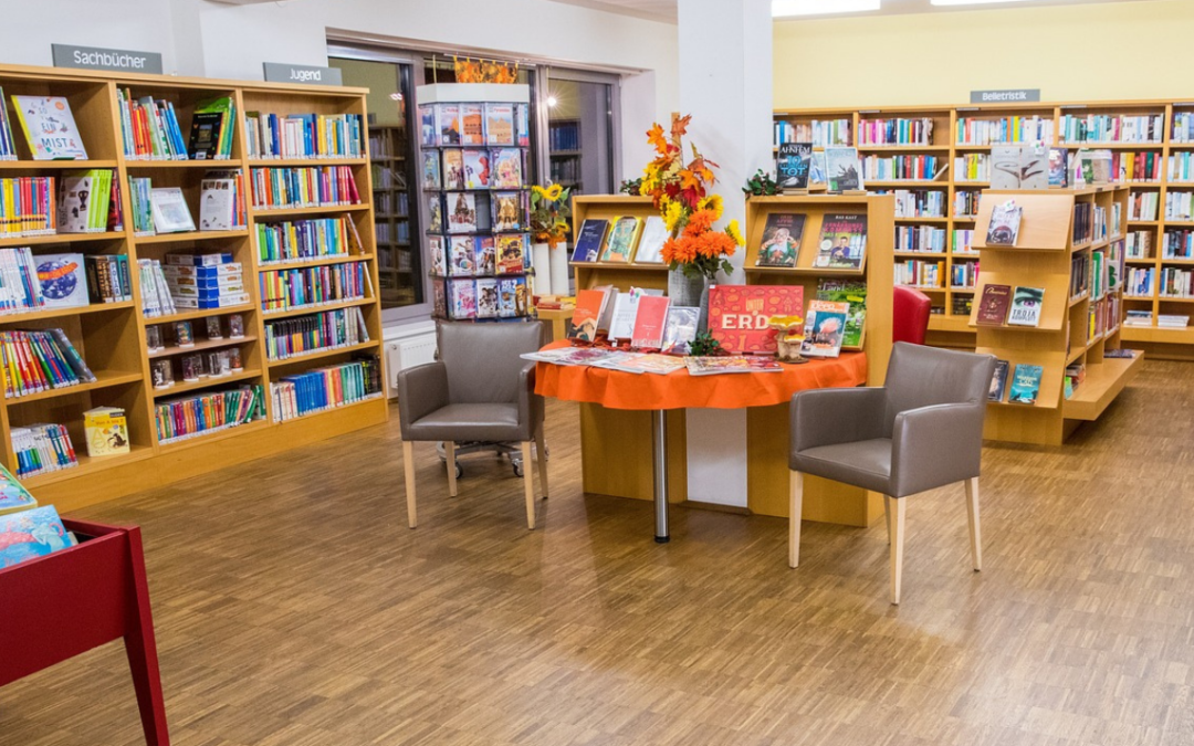 interior of a well-lit small bookstore to represent why you should support indie bookstores.