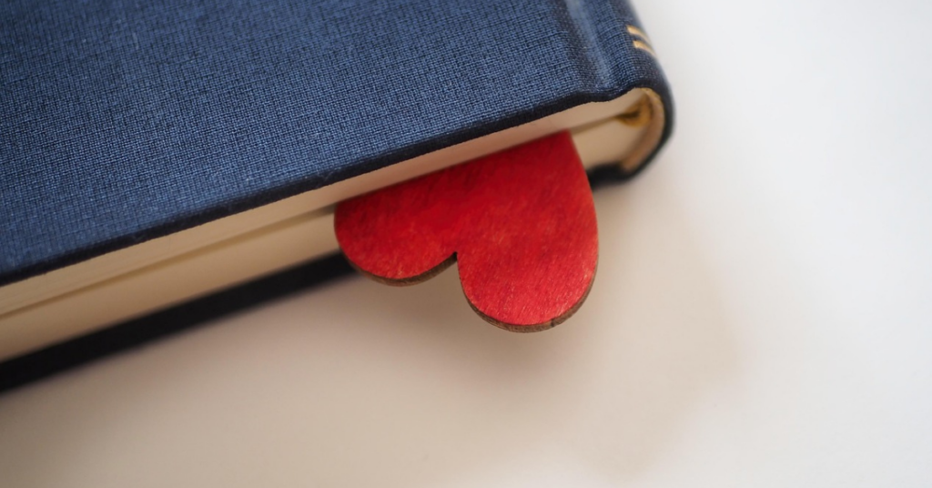 Black book with a felt heart bookmark to represent love and support  of indie bookstores.